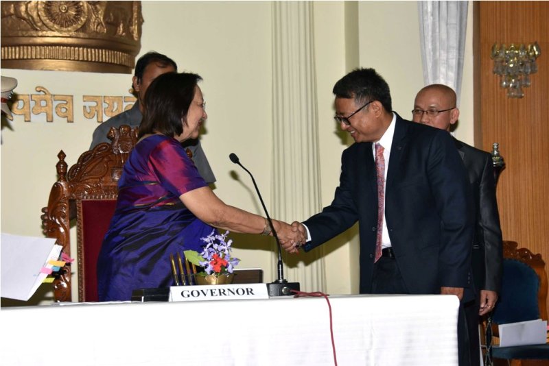 Dr S Ibocha and Oinam Sunil take oath as state Information Commissioners at Raj Bhavan