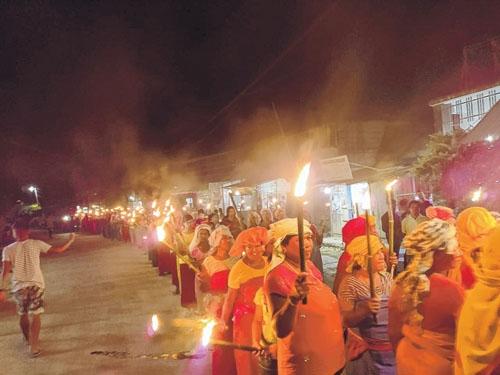 Protesters take out torch rally in different parts of Bishnupur