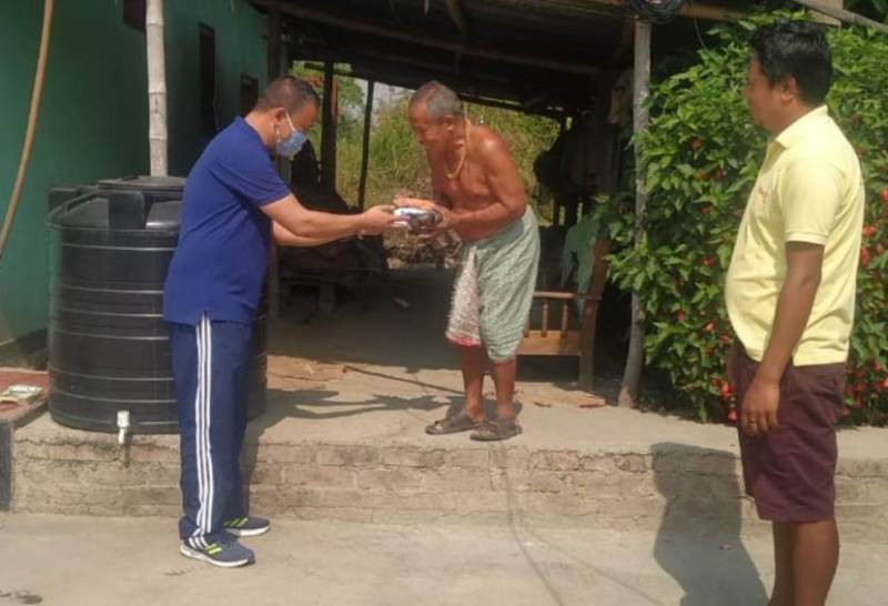 ZP member Niken Seram distributes relief material to around 11,000 household