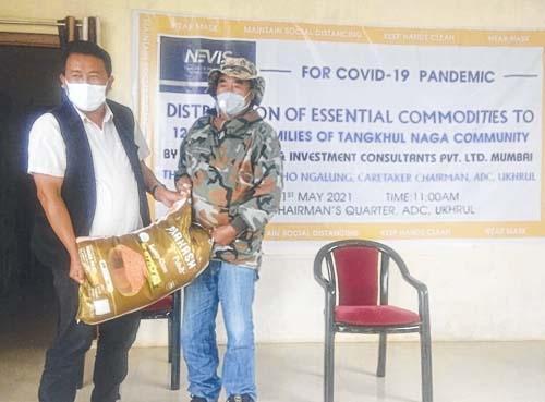 Dr Yaronsho Ngalung distributes essential items in Ukhrul town