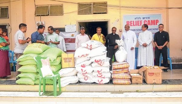 Diocesan Social Service Society distributes food kit to displaced people in Kakching