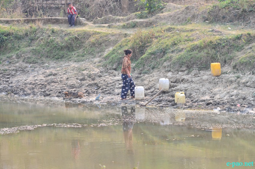 Water Scarcity : People fetching water on March 26 2015 at Gwaktabi, Yaingangpokpi Imphal Ukhrul Road