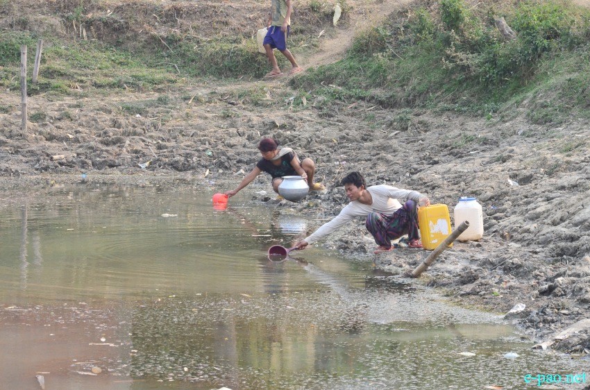 Water Scarcity : People fetching water on March 26 2015   at Gwaktabi, Yaingangpokpi Imphal Ukhrul Road