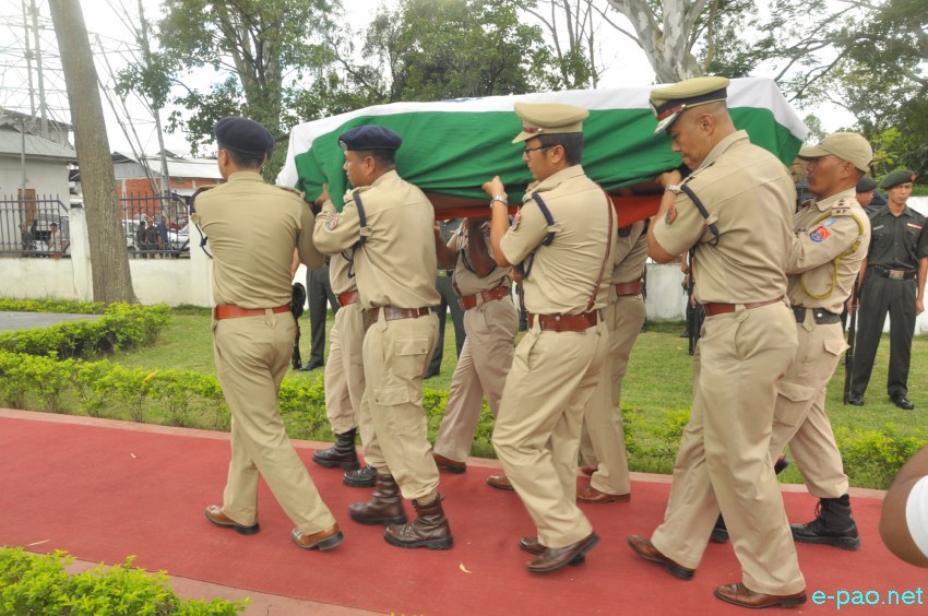 Tributes to slain commando, KS Thotyo, who died in an ambush at Nungshangkong,  at 1st Manipur Rifles complex :: 10 September 2014