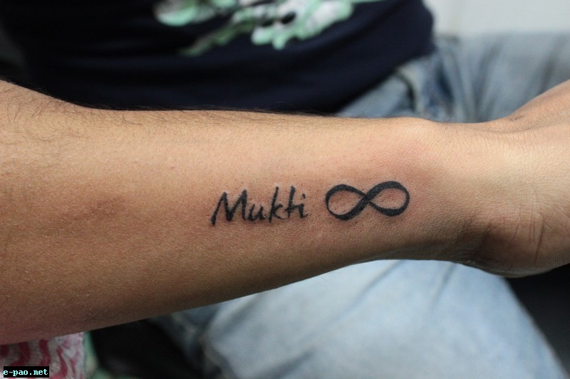 Jayanta with the tattoo which says - Mukti, his mother's name and the infinity symbol signifying his infinite love for her 