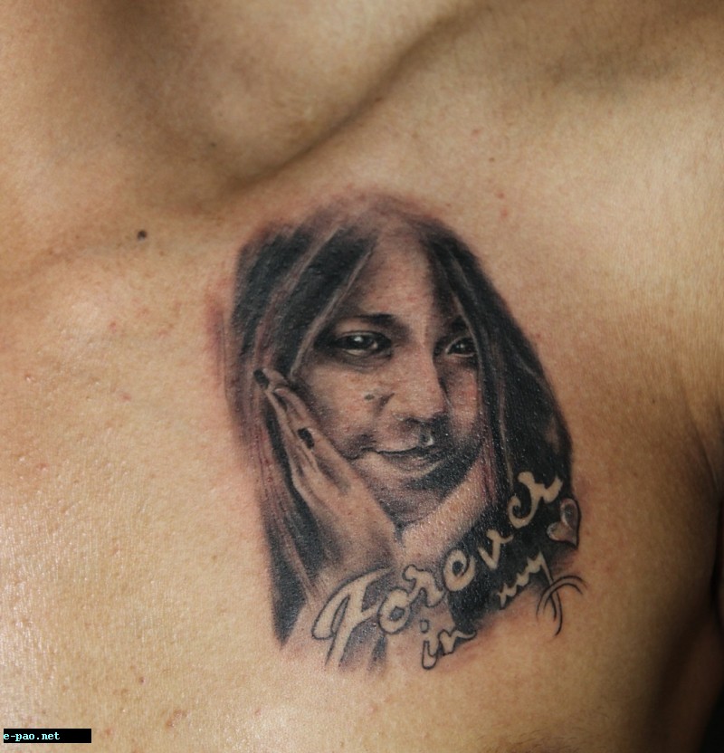 Potrait of Jamir's wife on his chest 
