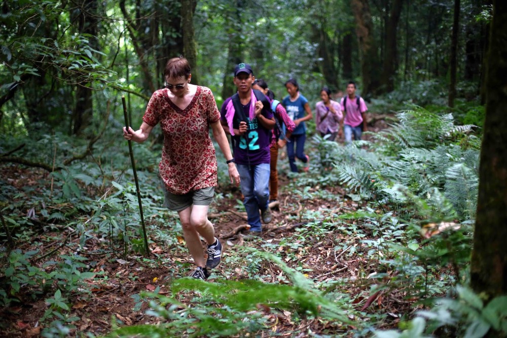Child traversing the forest on her way to Mt. Kisha.