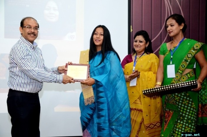  Dr Mridul Hazarika felicitating award to Ms Binalakshm Nepram