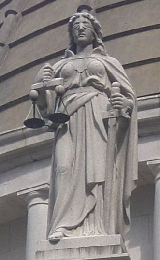 Statue of Lady Justice depicted as Themis above the Old Supreme Court building in Hong Kong 