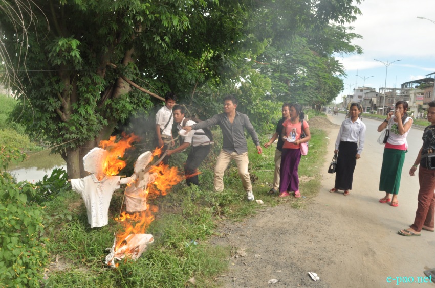 Co-Ordination Committee of Colleges Students Union Manipur (COCOSUM) burnt the effigy of the Chief Minister, Education Minister on July 11 2014
