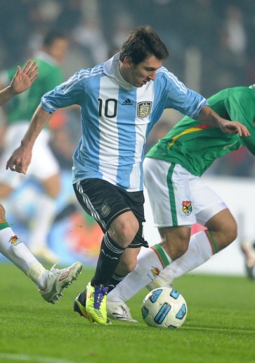 Messi, playing for Argentina in 2011, has been compared to compatriot Diego Maradona and two-time FIFA/Ballon d'Or winner Cristiano Ronaldo.