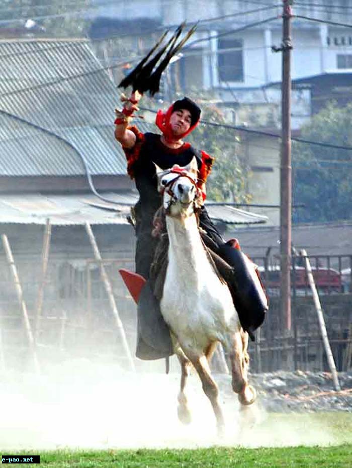 A Meitei horsemen throwing Arambai while galloping
