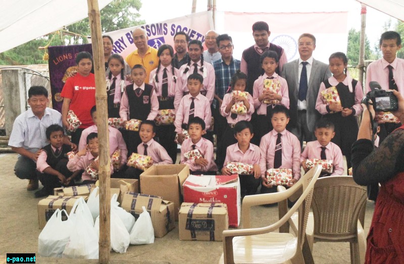Members of the Lions Club of Kohima (LCK) seen with differently abled students of Cherry Blossoms School, Kohima during their visitation to the School as part of the 69th Anniversary of the Indian Independence Day Celebrations on August 15, 2015. Students have been given towels and also had lunch together with the visiting Club Members