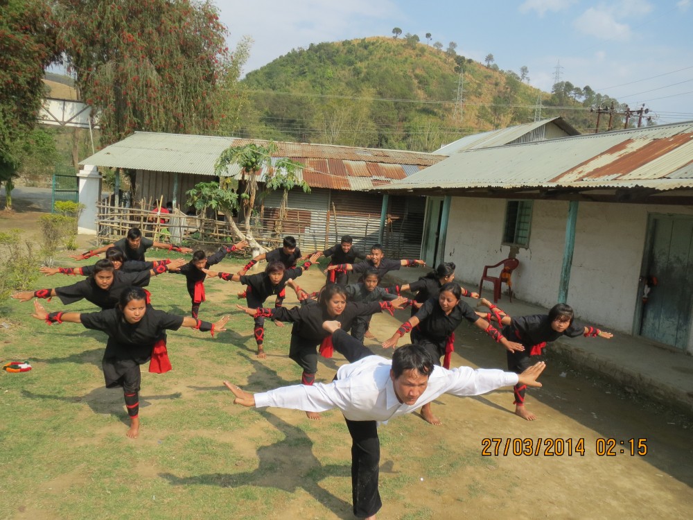 Rajen Mangang teaching his students on the basic of Manipuri martial arts Thang-ta