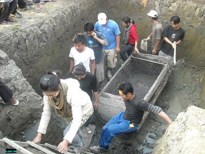 Students and researchers at the Thawan Thaba excavation site where the wooden coffin was discovered