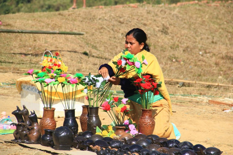  A woman selling the famous pottery made from Andro village 