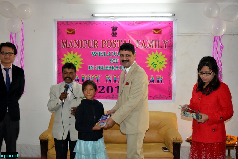 Shri Vinod Kumar Director Manipur presenting gift to a orphan girl 