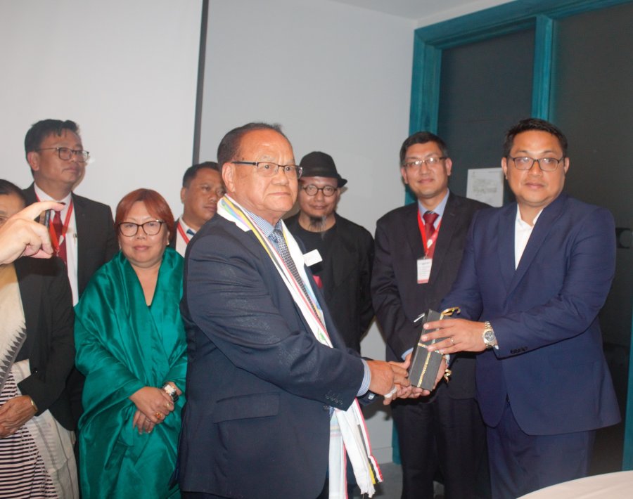  2nd KEN Convention in London on July 27 2019. President Dr Mohendra Irengbam handing over mementos to delegates 