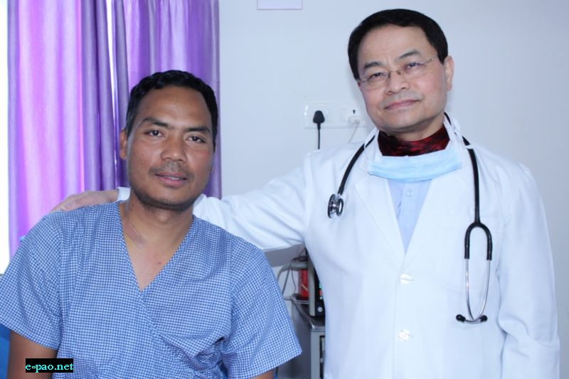  Happy patient Mr. Rochullova with Dr. L. Shyamkishore Singh, Chief Cardiologist of SKY Hospital at the time of discharge) 