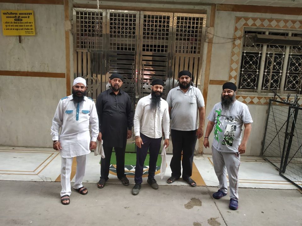  Sikh youth who volunteered to cook food for North East students are seen in this photo taken in front of Pichori Gurudwara, Subhash Nagar, Delhi  