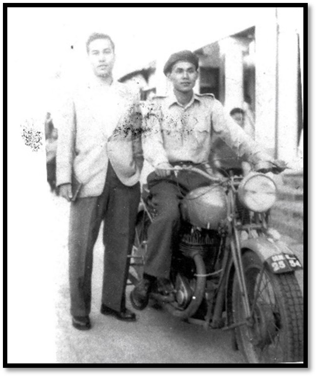  Author on a salvaged WWII motorbike with Kh Dhiren from Kongba [introduced high-yielding varieties of rice], after haircut by barber's saloons at Makha Dukan in 1955, during our summer holidays from college. 