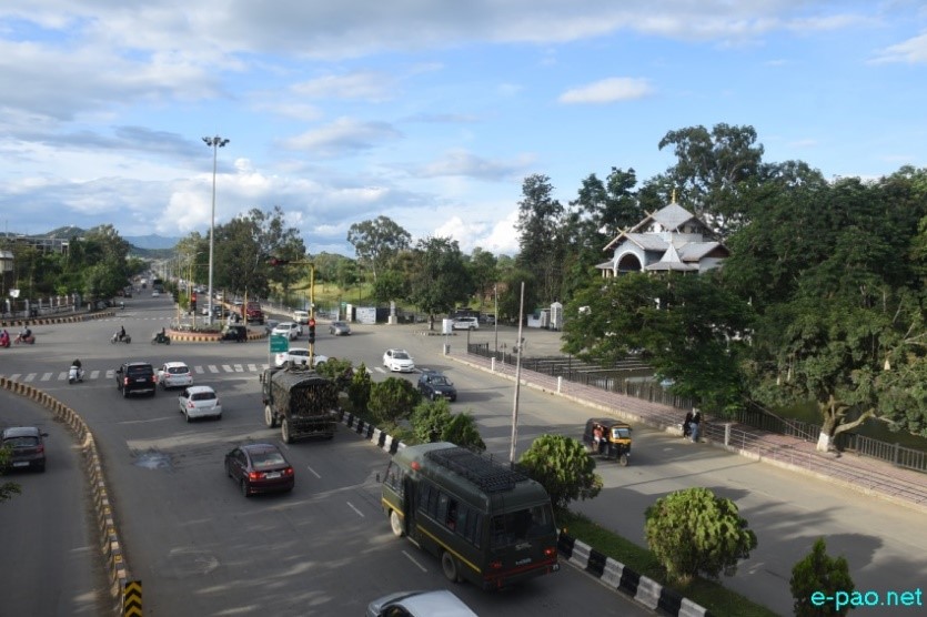 Four-Lane Ends, Imphal with cerulean sky and fluffy white clouds