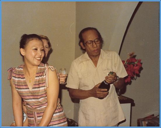 Dr Longjam Jogendra with Sonia (Philippine wife of late Chongtham Sarat) and Margaret behind, at his home in Nuneaton near Birmingham, opening a bottle of champagne. 