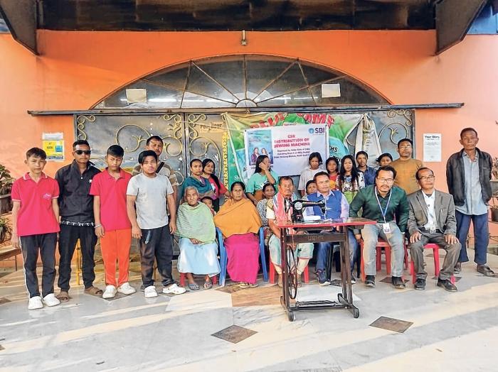 SBI Kakching branch donates sewing machines to relief camps
