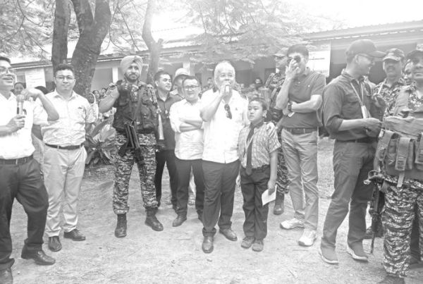 MP Bimol inspects stormed-damaged school