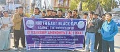 AMSU protests CAA, waves black flags