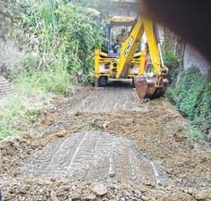 Road built under MGNREGA dug up