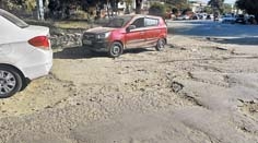 Potholes, garbage adorn Lamphel Traffic point