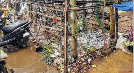 Discarded bottles adorn enclosure at BT Road