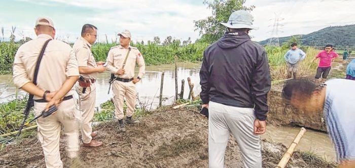 Nambul embankment breaches, flowing above warning level